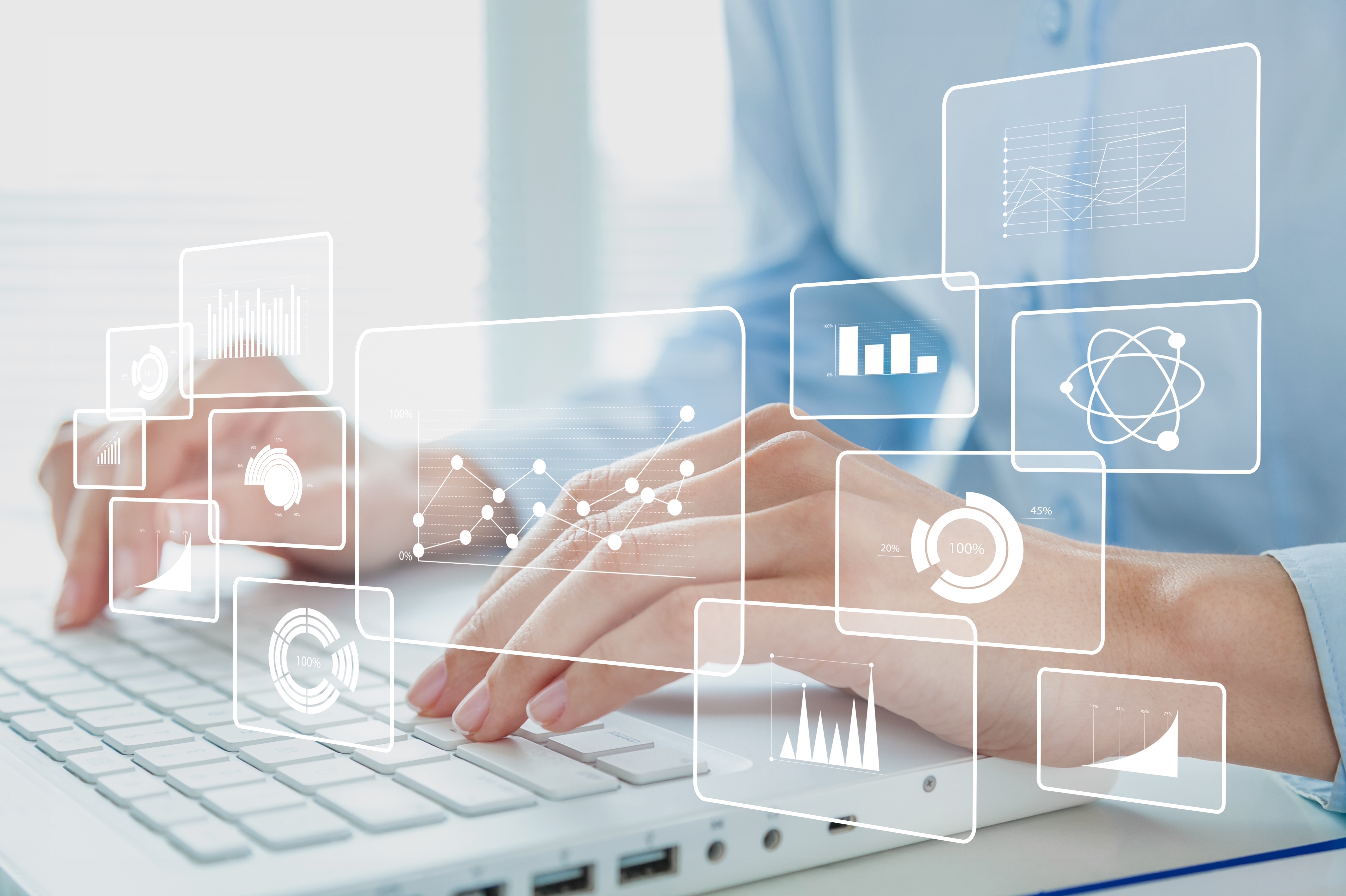 Human hands working on a modern laptop